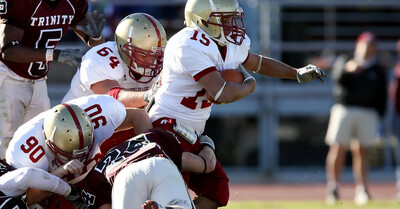 football player running and possibly going to receive a concussion